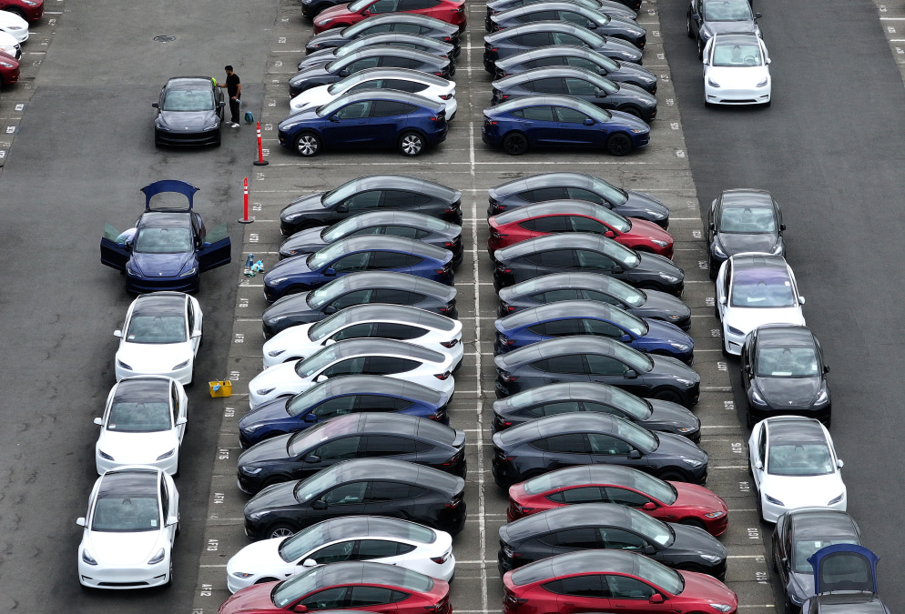 Tesla beats delivery estimates with less-drastic drop in EV sales